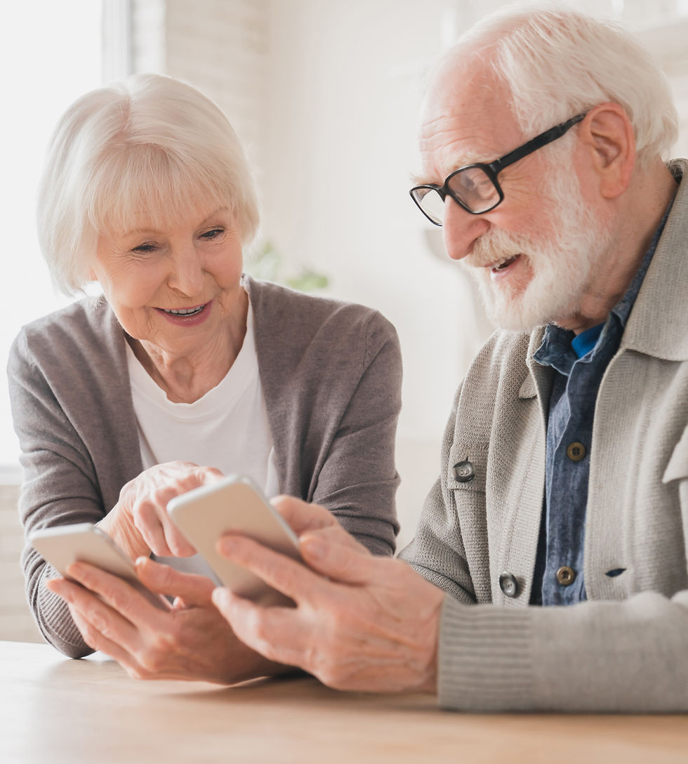 Happy smiling caucasian senior elderly couple grandparents spouses using smart phones cell